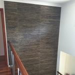 Black grasscloth wallpaper in stairwell - Broadbeach Waters