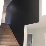 Black vinyl wallpaper on staircase