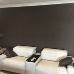 Chocolate brown wallpaper in loungeroom at Coomera Waters
