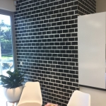 Underwood wallpaper installation using black brick wallpaper