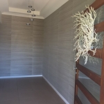 grasscloth wallpaper in entry - Windaroo wallpaper installation