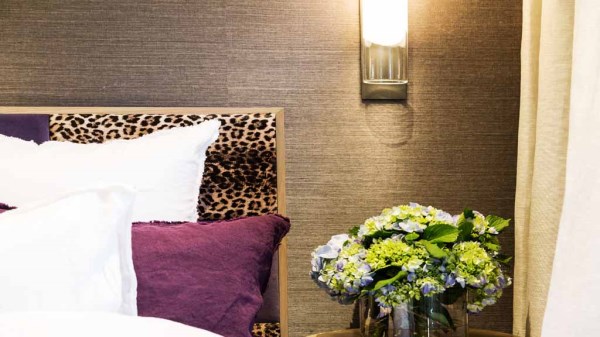 Dee's grasscloth wall with leopard bed
