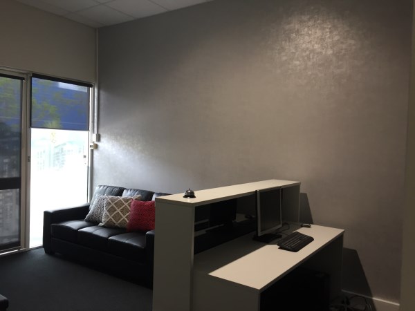 reception area using grey vinyl wallpaper