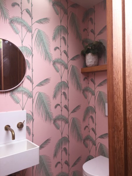 Shelly's toilet after installing palm tree wallpaper
