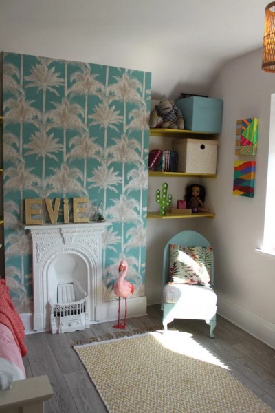 Palm print wallpaper gives a young girl's bedroom a lift